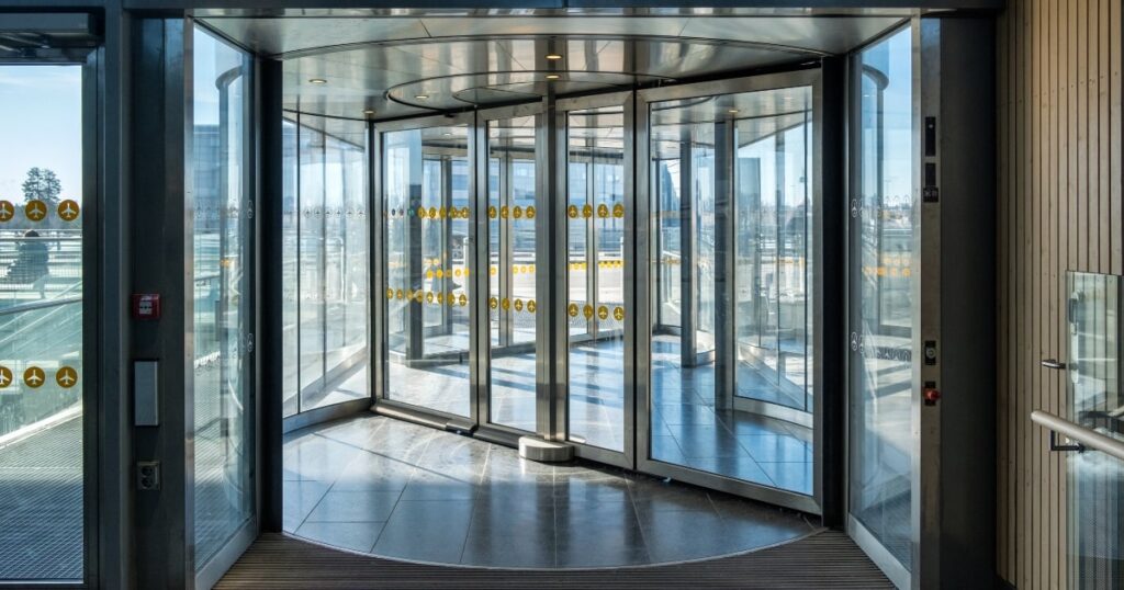Air curtains work best when used with automatic doors, such as revolving doors.